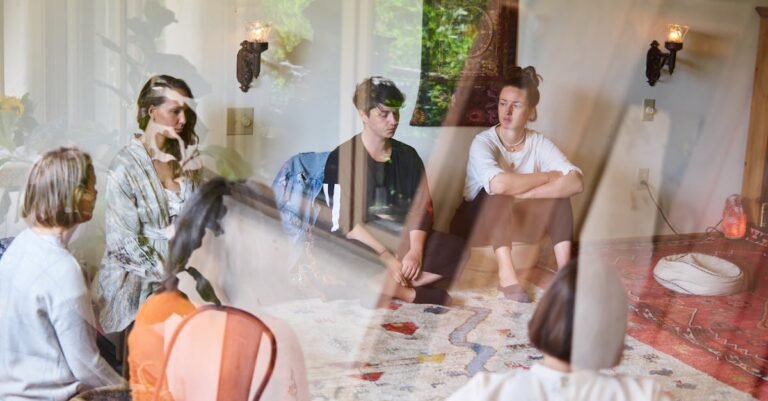 Group therapy session in a federal RDAP residential drug abuse program with participants sitting in a circle